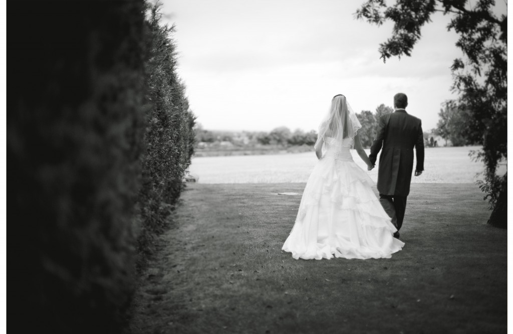 Bride and groom walk hand in hand. Lancashire Wedding Photography