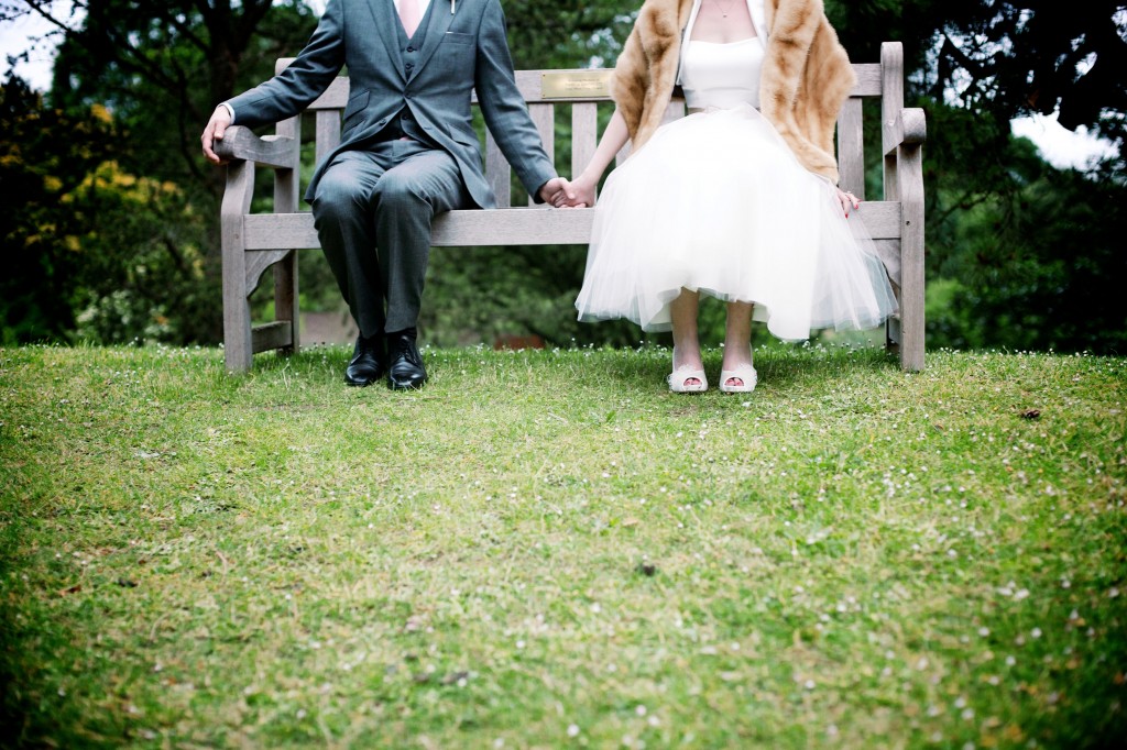 Kew Gardens wedding photographer, couple sitting on a bench