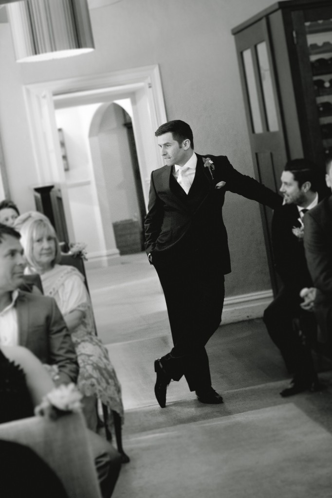A groom hanging out, waiting for his bride to arrive. Beautiful professional wedding photography, Linthwaite House Hotel