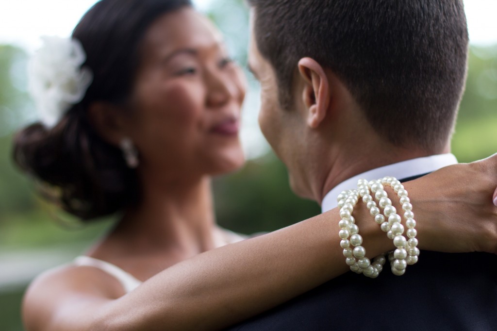 Bride's pearl bracelets. Stunning and creative wedding photography in Cumbria