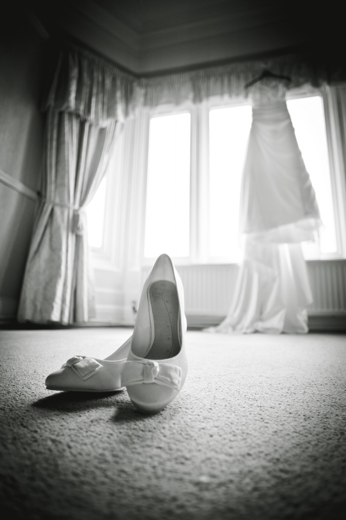 Wedding bridal preparations, detailed shot of shoes and dress