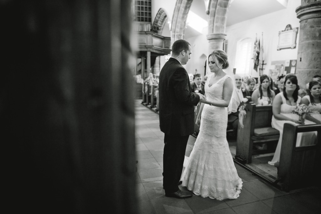 Exchanging of rings- bride and groom in church, beautiful wedding photography Lancashire