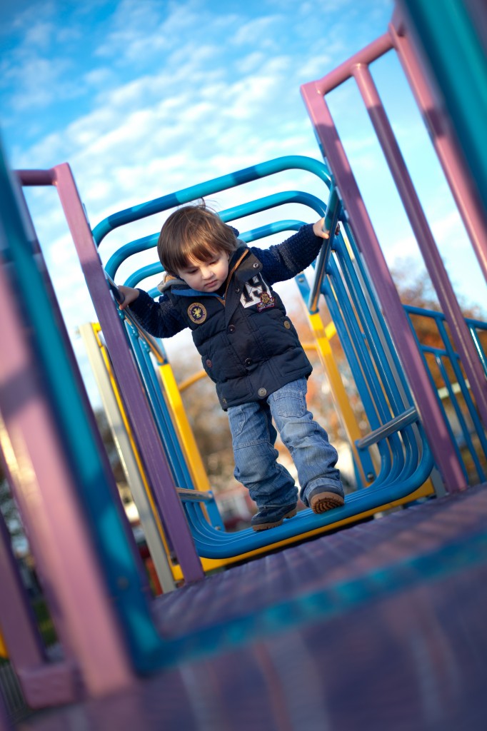 Playing on the playground at Ashton Park, Preston in Lancashire