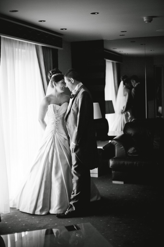Couple Touching Foreheads in Liverpool | Suites Hotel Wedding Photographer