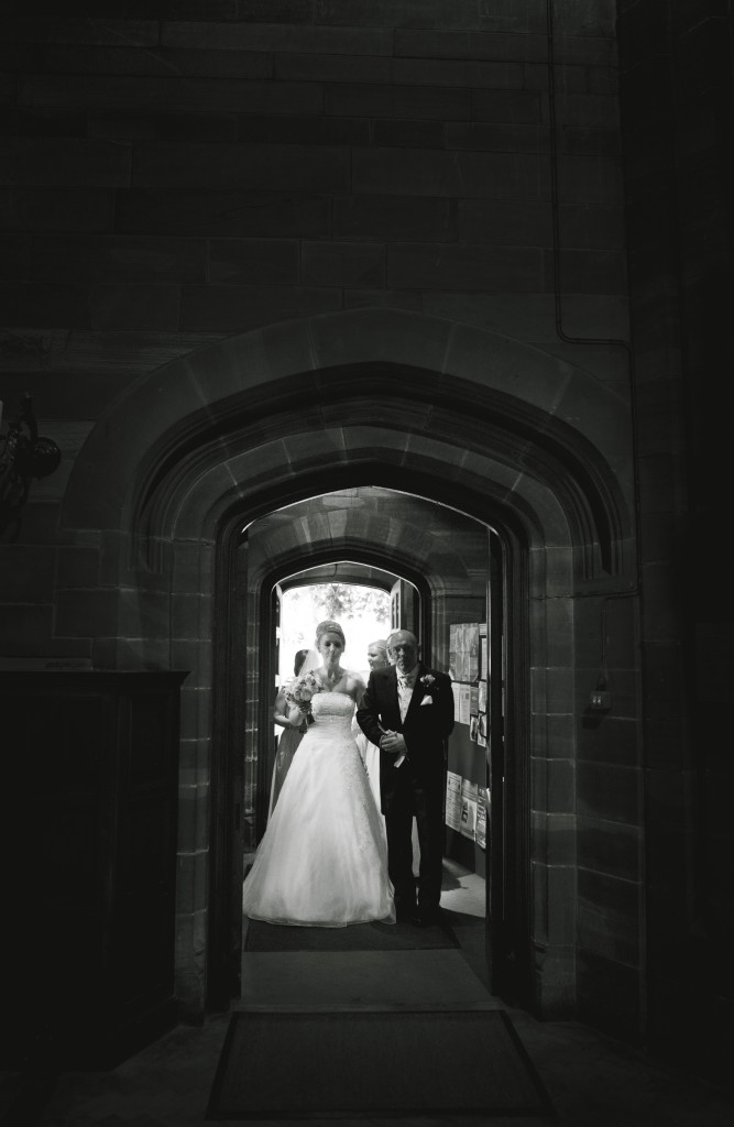 Bride walking into the church with her father. Ashfield House Wedding Photography