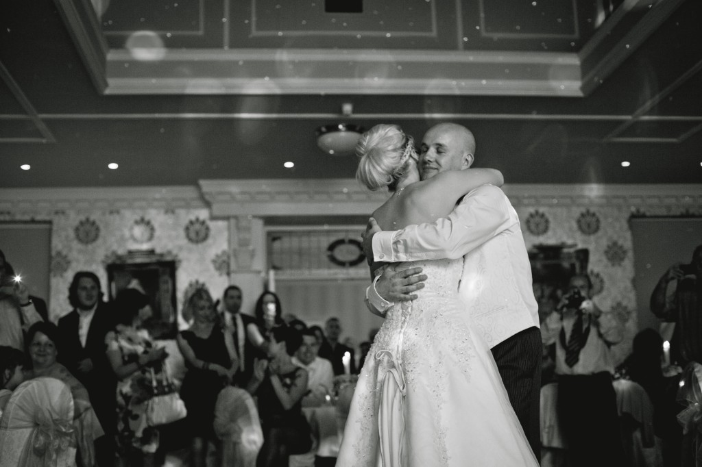 Wedding Photography - the first dance. Bride and groom embrace. Lancashire