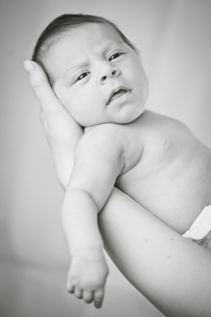 One gorgeous little girl looking at the camera, Newborn Portraits Lancashire
