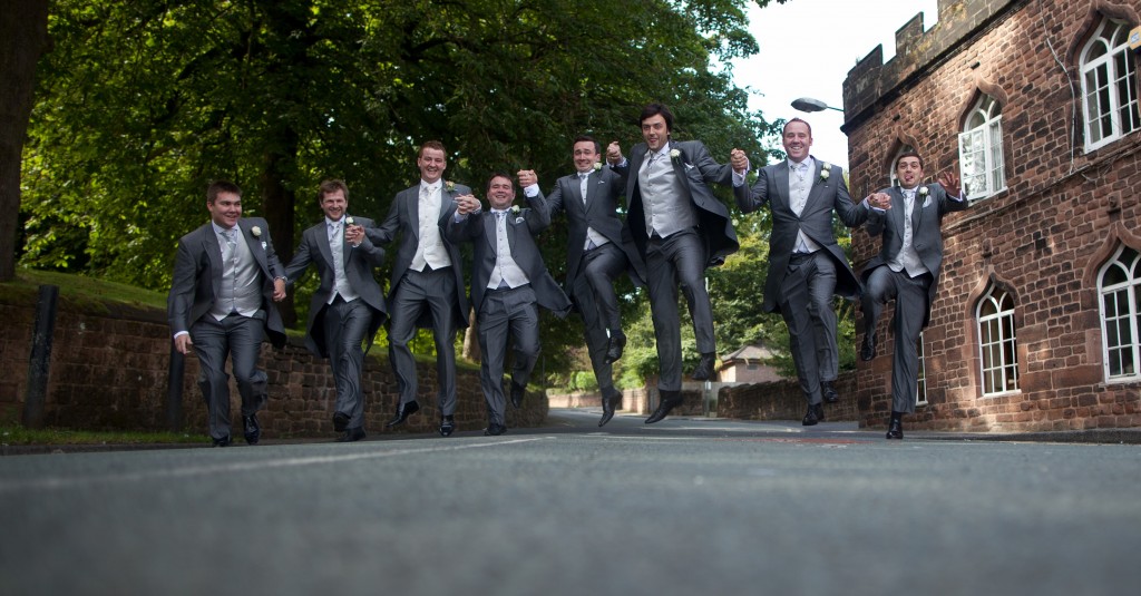 Jumping in the air, a groom and his grooms men Lancashire