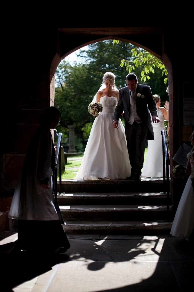 Walking into the church in Lancashire. Beautiful wedding photography