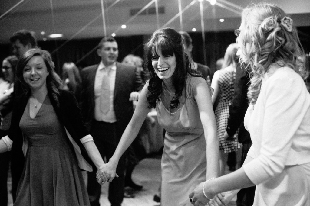 Guests laughing during wedding reception