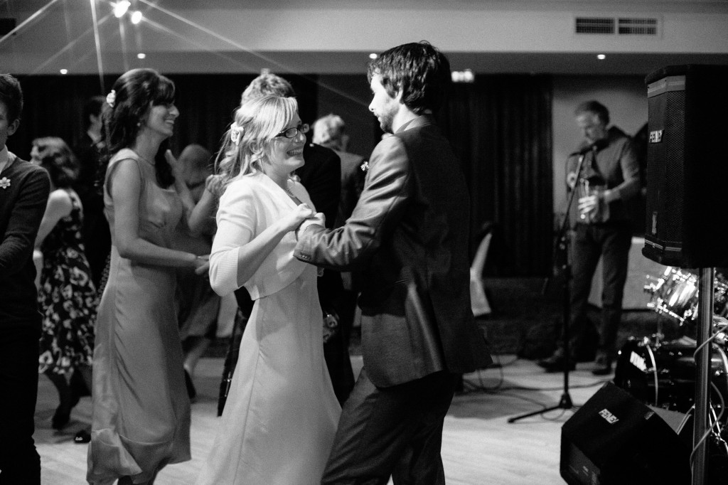 Wedding guests laughing, dancing