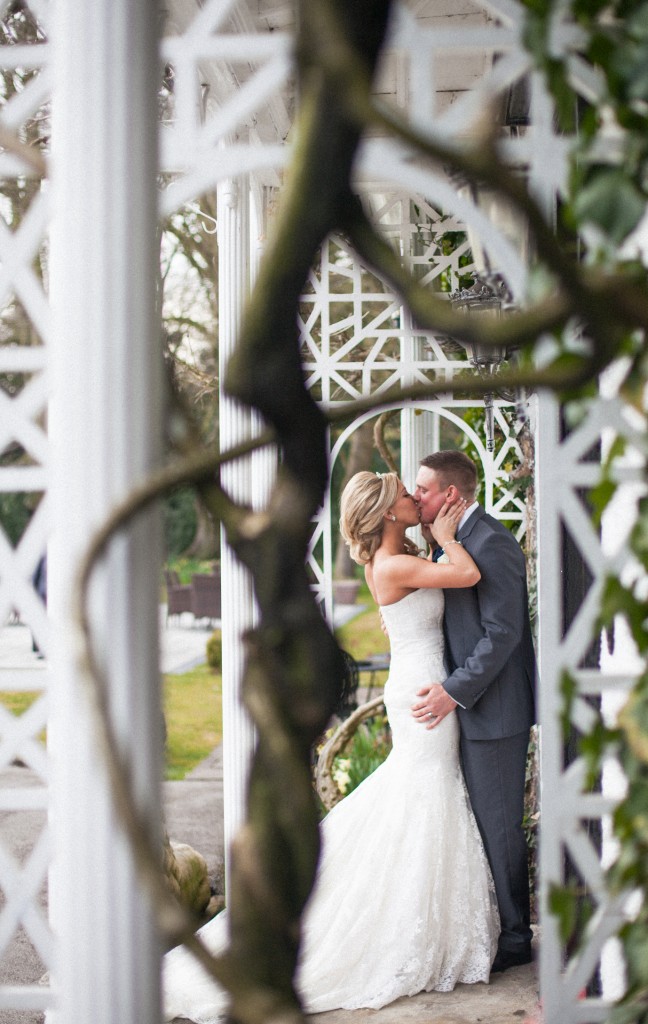 Bride and groom kissing photograph