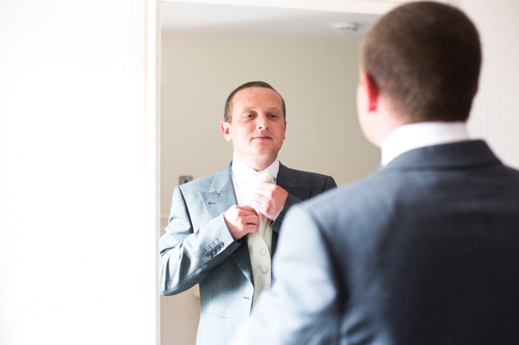 A groom gets ready in his room at Gretna Green