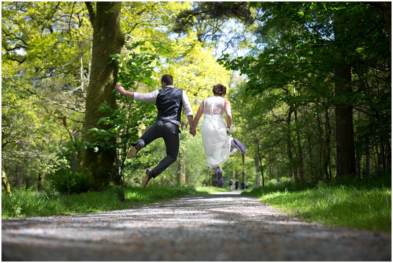 A couple jumping in the air Cumbria Wedding photography
