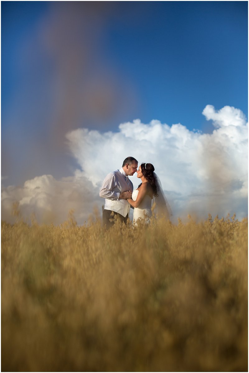 Bride and groom in field at West Tower Lancashire wedding photography