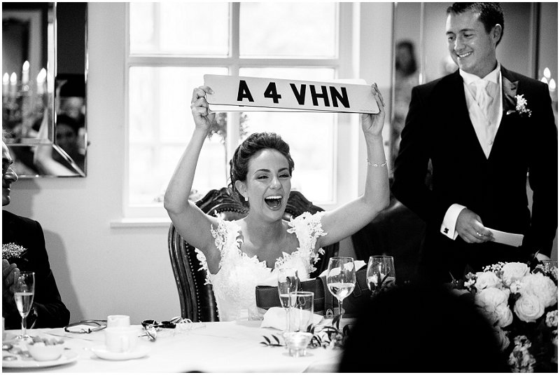 Bride holds up personalised license plate