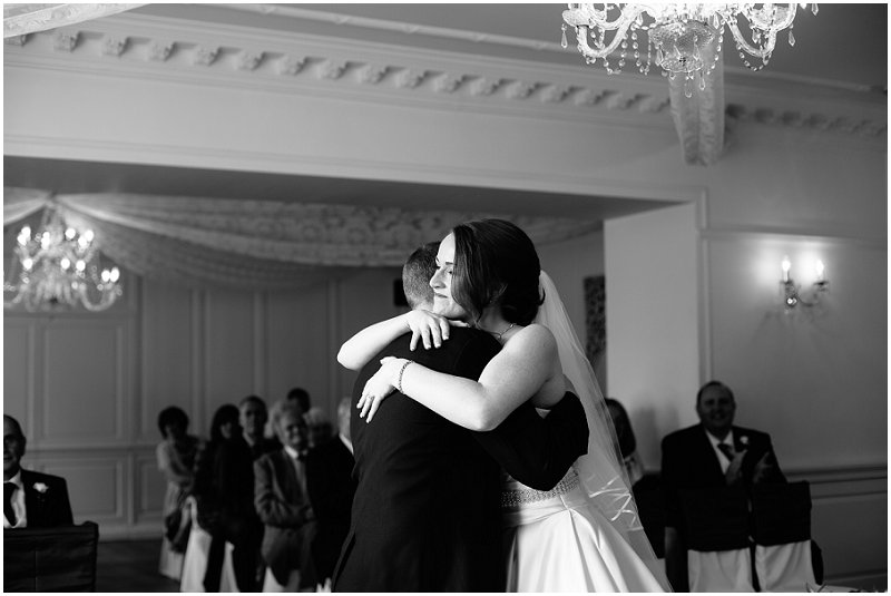 Bride and groom hug at Eaves Hall Lancashire