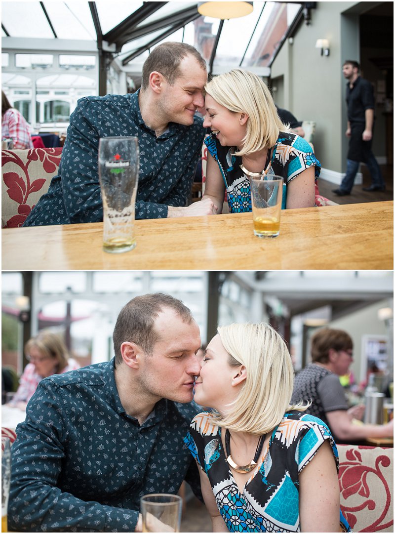A couple in Love during engagement shoot at  a Bar