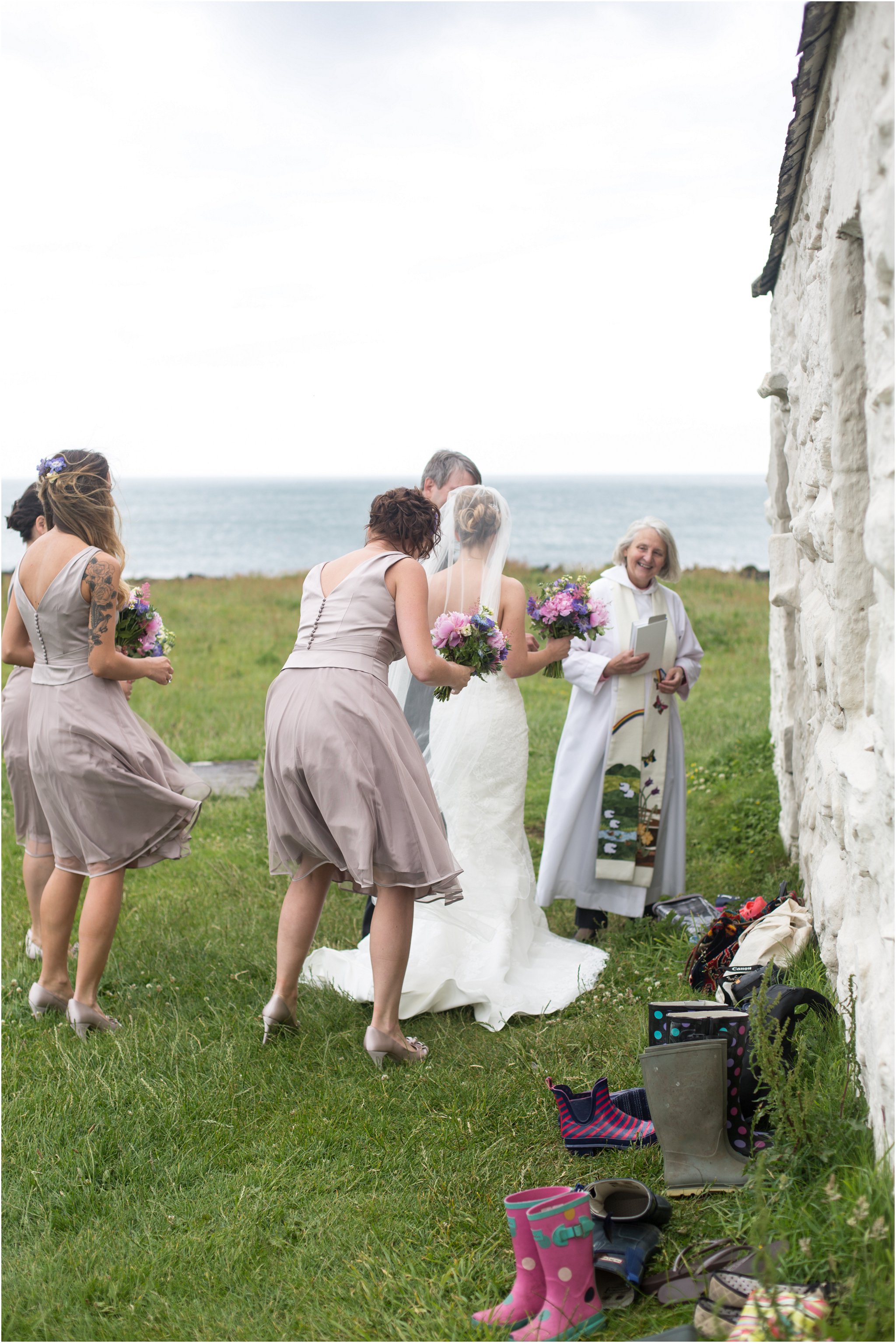 Bride enters the Church on the Sea at Anglesey Wedding Photographer