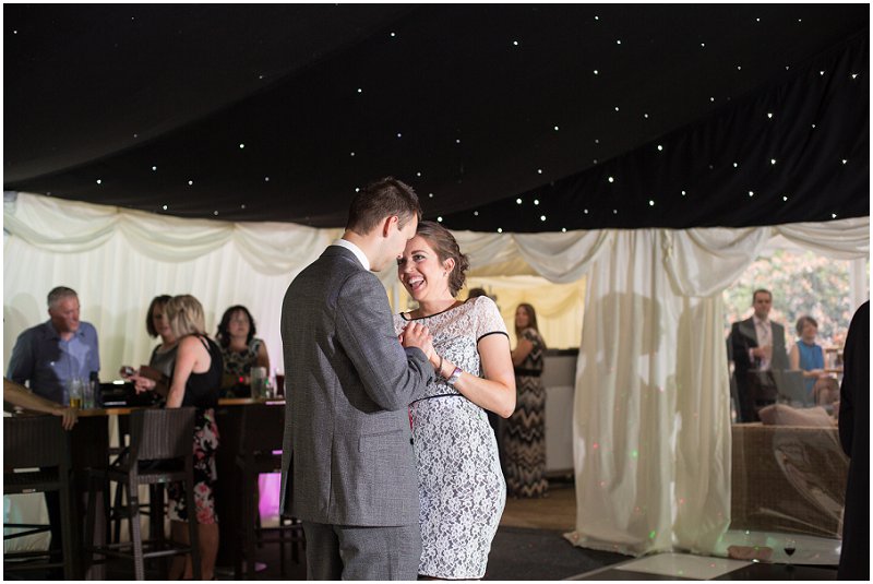 Laughter and dancing during wedding reception 