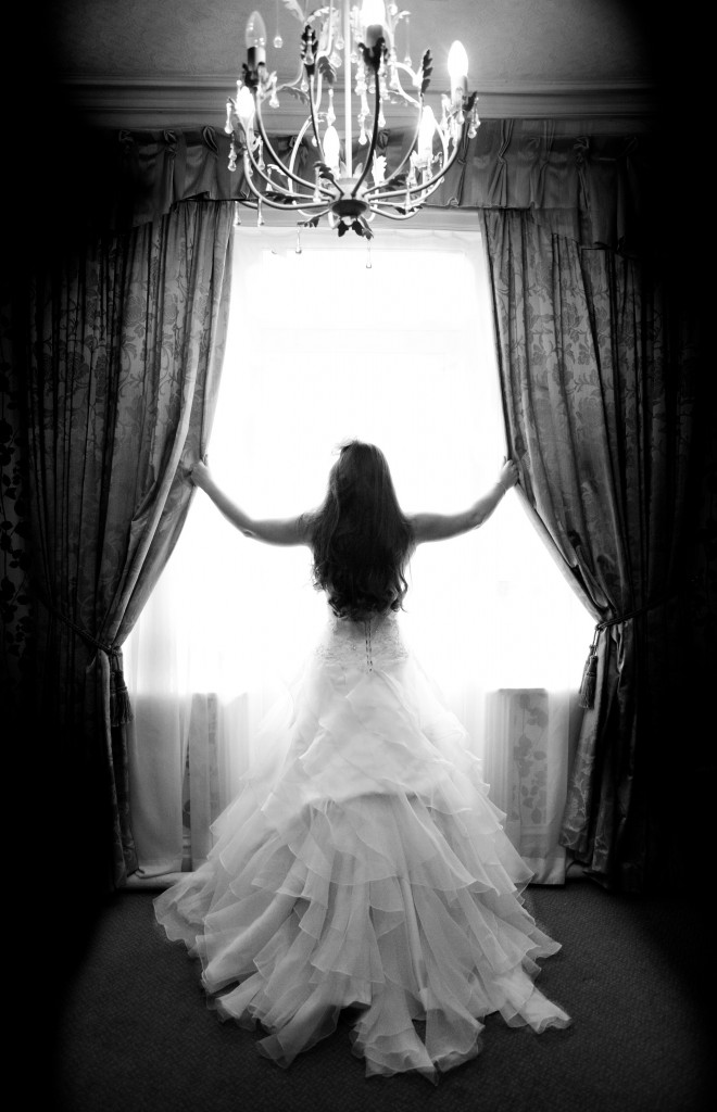 Bride Opening Curtains at Northop Hall, North Wales