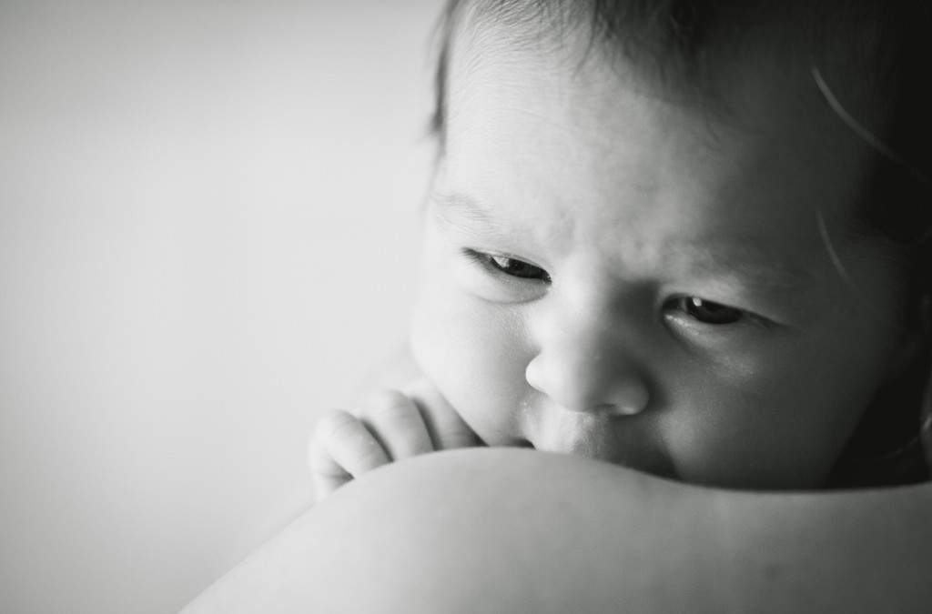 Laying on her Mummy's shoulder- a gorgeous newborn. Lancashire Portrait Photographer