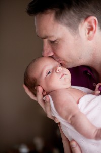 Father Kisses Newborn Lifestyle Photography Liverpool