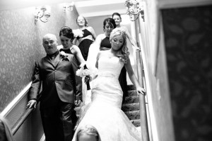 Bride coming down stairs at Statham Lodge