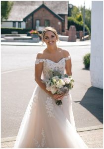 Bride walking to Famous blacksmiths shop in Gretna