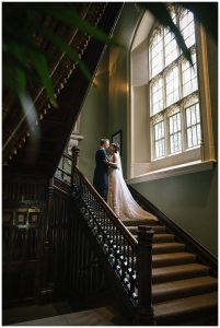 wedding photo of bride and groom on staircase