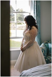 Bride in window Yorkshire wedding photographs